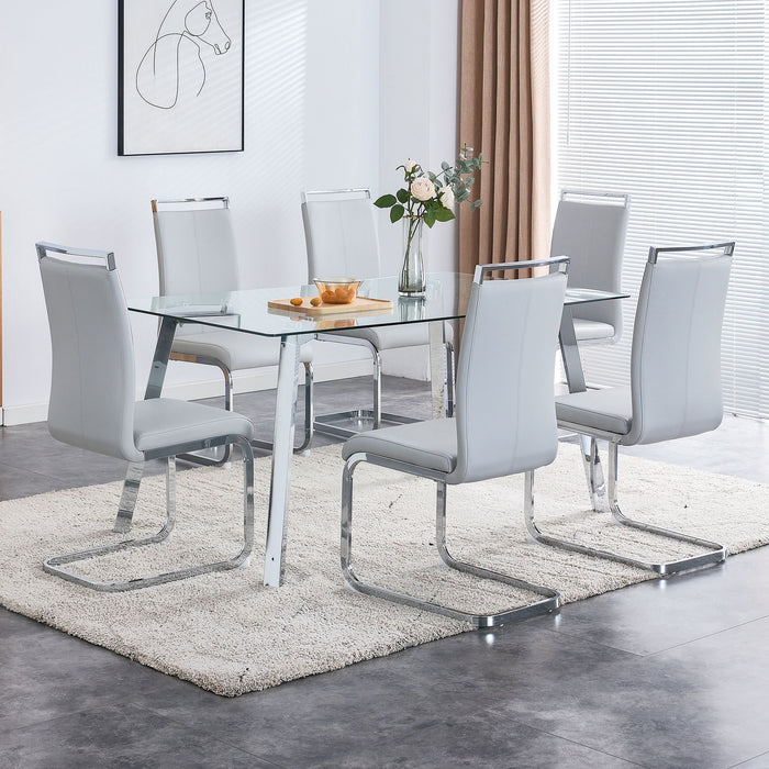 A Modern Minimalist Rectangular Glass Dining Table With Tempered Glass Tabletop And Silver Metal Legs, Suitable For Kitchens, Restaurants, And Living Rooms