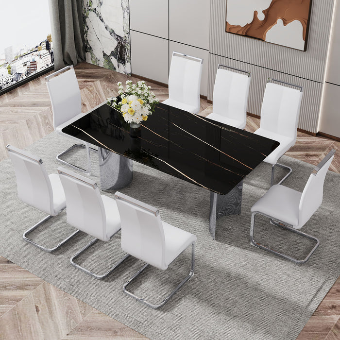 Modern Minimalist Dining Table The Black Imitation Marble Glass Desktop Is Equipped With Silver Metal Legs Suitable For Restaurants And Living Rooms