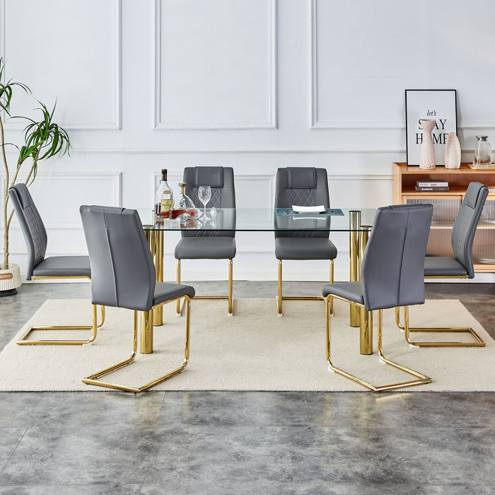 Table And Chair Set, 1 Table With 6 Grey Chairs. Transparent Tempered Glass Tabletop With A Thickness Of 0.3 Feet And Golden Metal Legs. Paired With PU Grey Seat Cushions And Gold Leg Cushioned Seat